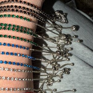 Multiple colors. Silver tone. Adjustbl Bracelet slide clasp.16 total